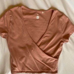 Super cute light pink cropped crossover tshirt from Pac Sun size smaller
